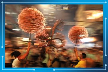 Members of the fire dragon dance team spin balls of joss sticks during the Tai Hang Fire Dragon Dance in Hong Kong. To illustrate Asian universities gathering momentum in the THE World University Rankings. Members of the fire dragon dance team spin balls of joss sticks during the Tai Hang Fire Dragon Dance in Hong Kong. To illustrate Asian universities gathering momentum in the THE World University Rankings.