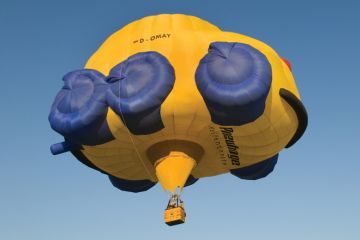 Flying hot-air balloon shaped as car, Rhineland-Palatinate, Germany