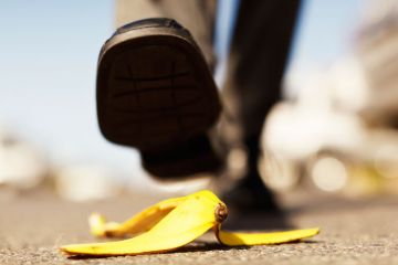 Foot about to step on banana peel