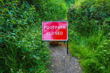 A footpath with a sign saying it is closed, illustrating restrictions on free speech A footpath with a sign saying it is closed, illustrating restrictions on free speech