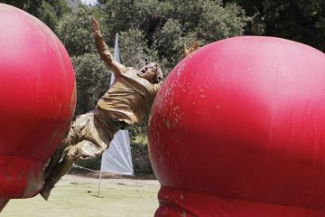 Gameshow contestant falling into mud pit Gameshow contestant falling into mud pit