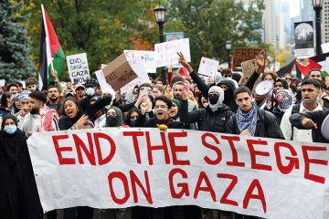 Protesters, mostly university students, gather to protest against Israeli airstrikes in Gaza, at Queen's Park outside the Legislative Assembly of Ontario in Toronto, Canada to illustrate Can campus debate about Gaza be civil?