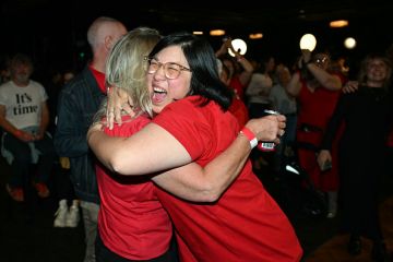 Labor Party supporters react as national broadcaster ABC projected a win for the party Labor Party supporters react as national broadcaster ABC projected a win for the party