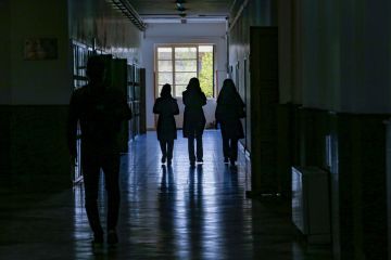 Iranian male and female students passing through Iranian university halls Iranian male and female students passing through Iranian university halls