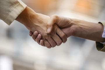 Two people shaking hands Two people shaking hands