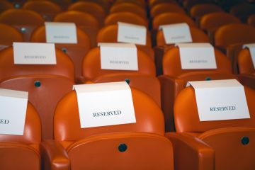 Reserved seating in an empty movie theatre Reserved seating in an empty movie theatre