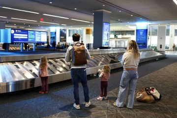 A family waits at baggage claim at LaGuardia Airport in New York on February 22, 2026 A family waits at baggage claim at LaGuardia Airport in New York on February 22, 2026