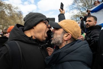 Two opposing side facing off by shouting at each other during a rally in London Two opposing side facing off by shouting at each other during a rally in London