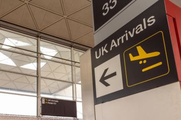UK arrivals sign in a modern airport terminal UK arrivals sign in a modern airport terminal