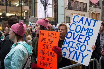 Participants at the Women's March in New York City on January 21, 2017. The placard at centre refers to US President Donald Trump and reads: 'Can't comb over misogyny' Participants at the Women's March in New York City on January 21, 2017. The placard at centre refers to US President Donald Trump and reads: 'Can't comb over misogyny'