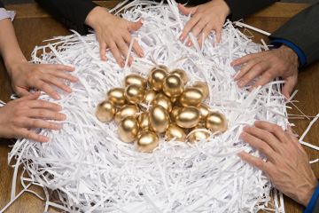 Colleagues around a nest of gold eggs Colleagues around a nest of gold eggs