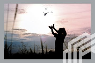 A woman releasing birds, illustrating how institutions view their mission as something much larger than their own academic excellence. A woman releasing birds, illustrating how institutions view their mission as something much larger than their own academic excellence.
