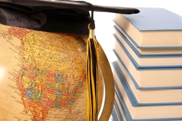 Studying around the world Globe with books