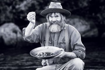 Gold rush prospector with gold nuggets