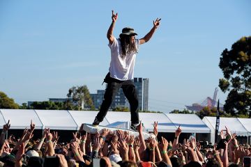 Crowd surfing at the Good Things Festival, Melbourne, Australia to illustrate ‘Overarching’ missions ‘boost research efficiency’