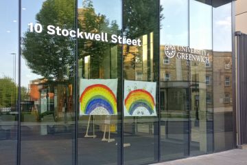 Hand drawn rainbow expressing thank to NHS and key workers displayed at glass window University of Greenwich during coronavirus outbreak Hand drawn rainbow expressing thank to NHS and key workers displayed at glass window University of Greenwich during coronavirus outbreak