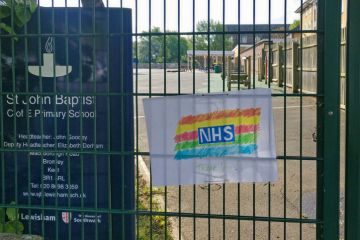 Hand drawn rainbow with thank you note to NHS displayed on fence Hand drawn rainbow with thank you note to NHS displayed on fence