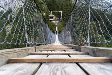 Handeggfallbrücke, a pedestrian bridge located in the heart of the Swiss Alps Handeggfallbrücke, a pedestrian bridge located in the heart of the Swiss Alps
