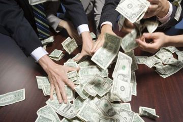 Hands grabbing dollar bills Hands grabbing dollar bills
