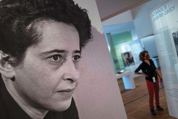 A photograph of German-American philosopher and political theorist Hannah Arendt (L) is on display during a press preview of the exhibition “Hannah Arendt and the Twentieth Century” at the German Historical Museum