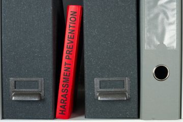 Harassment Prevention guide book on the shelf
