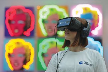 A visitor to Art Russia uses a VR headset near Olga Rozanova’s ‘Admiration’