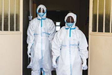 Health workers wearing protective clothing
