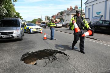 Police and workers put cones around sink hole in road. To illustrate that ResearchPlus must carve out a distinctive niche to avoid falling into the pitfalls of its predecessors. Police and workers put cones around sink hole in road. To illustrate that ResearchPlus must carve out a distinctive niche to avoid falling into the pitfalls of its predecessors.