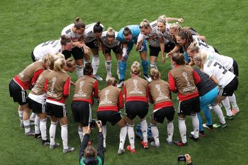 The German players form a team huddle prior to the 2019 FIFA Women’s World Cup match between Germany and Spain, Valenciennes, France The German players form a team huddle prior to the 2019 FIFA Women’s World Cup match between Germany and Spain, Valenciennes, France