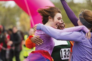 Women embrace after race