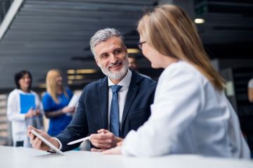 A medic talking to an MP
