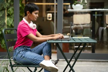 An Indian student or entrepreneur works on her laptop