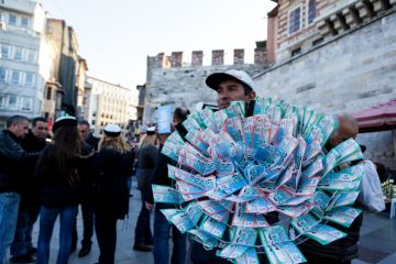 Istanbul, TURKEY - DECEMBER 15, 2012 A Man is selling New Year Lottery tickets of Turkey, It's called milli piyango Nigmet Abla