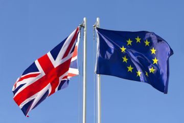 UK and EU flags on flagpoles