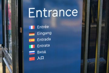 Sign reads 'entrance' in seven languages