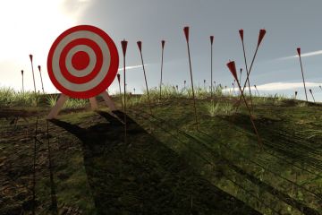 An archery target surrounded by arrows stuck in the ground