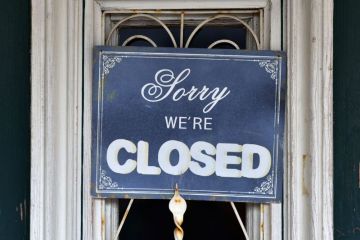Close up of the door of a closed restaurant with a sign "Sorry we're closed" in Schörfling, Upper Austria, Austria, Europe