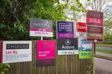 color image depicting a collection of different property for sale and sold signs in a residential district in the town of Crawley, UK. color image depicting a collection of different property for sale and sold signs in a residential district in the town of Crawley, UK.