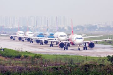 Aeroplanes queue for takeoff on runway in Ho Chi Minh City