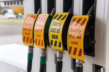 Out of use signs on petrol station pumps 