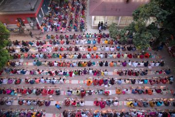 Thousands of Hindu devotees sits with Prodip and prays to God in front of Shri Shri Lokanath Brahmachari Ashram temple Thousands of Hindu devotees sits with Prodip and prays to God in front of Shri Shri Lokanath Brahmachari Ashram temple.