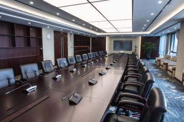 Boardroom with chairs and intercom system 