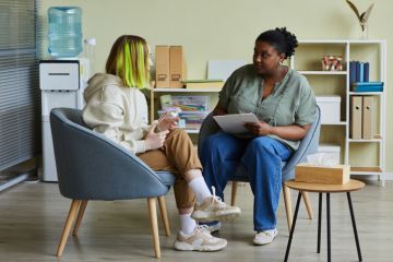 A counsellor talks to a student