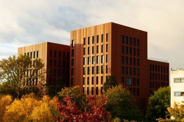 View of the University of Warwick surrounded by autumn trees