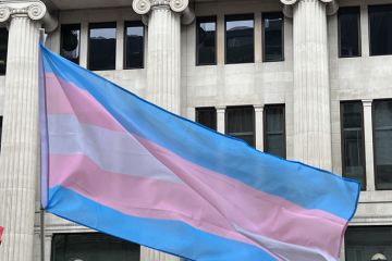 Trans flag held up in air
