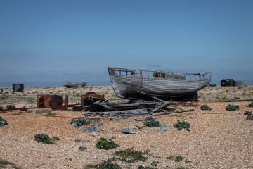 A wrecked boat on Dungeness beach A wrecked boat on Dungeness beach
