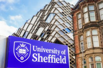 Close up of a sign for the University of Sheffield, with The Diamond building,