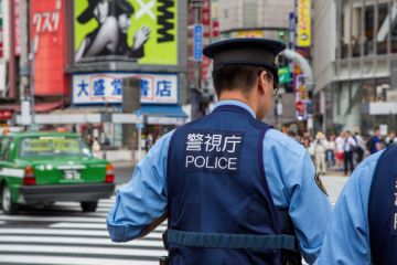 Japanese police presence at Shibuya Crossing, known as the scramble, the busiest pedestrian crossing in the world. Japanese police presence at Shibuya Crossing, known as the scramble, the busiest pedestrian crossing in the world.