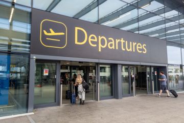 The sign for the departure hall of Gatwick Airport north terminal building