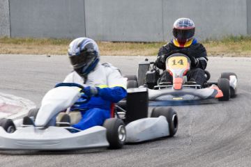 Two go-kart drivers racing